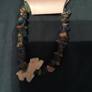Stone bracelet with stone animal